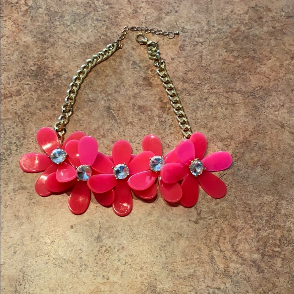Hot pink plastic floral/rhinestone necklace.